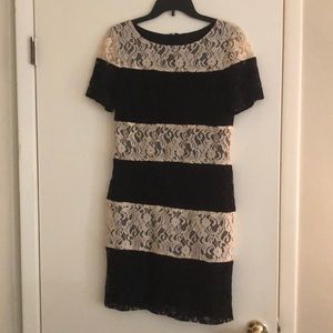 Short black and cream striped dress with sleeves.